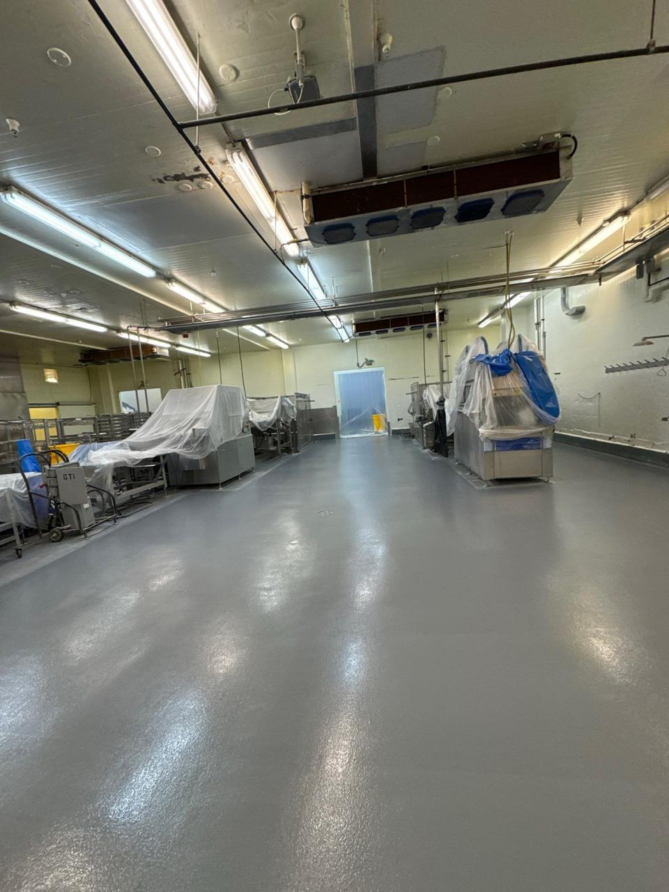 Food plant flooring project Recoated floor around covered processing equipment in a food plant
